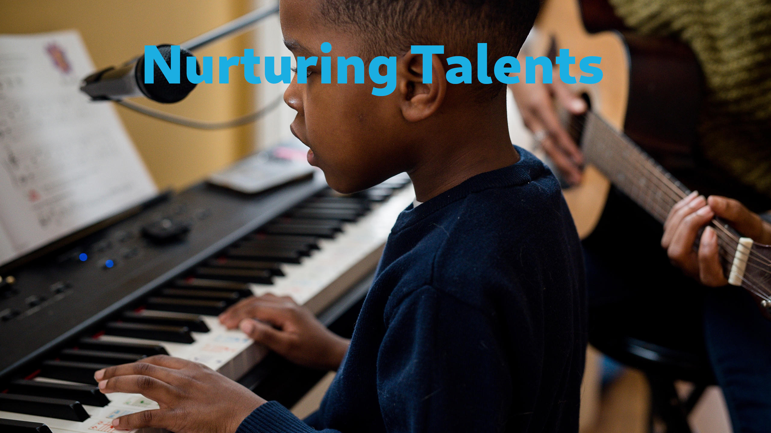 A boy playing the piano
